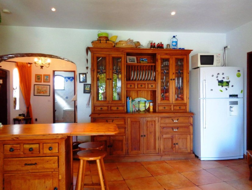 kitchen with a wooden cabinet and a wooden island