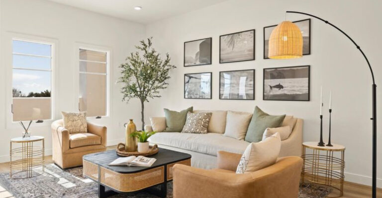 living room with neutral colors, arched lamp and a gallery wall