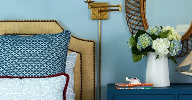 blue painted bedroom with a blue cabinet and blue pillows