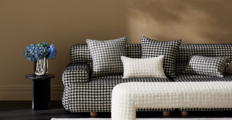 living room with a patterned and textured sofa and table