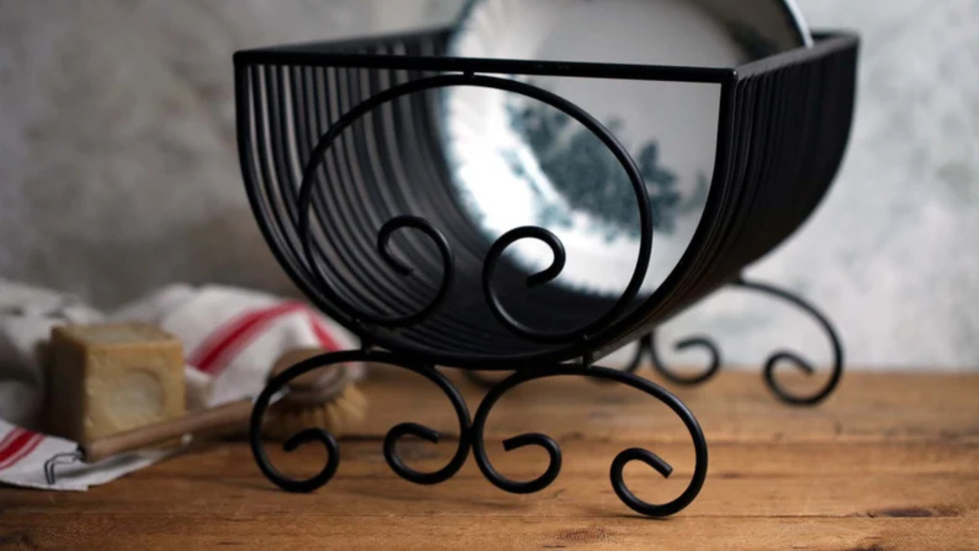 wire dish on the counter with the plate inside