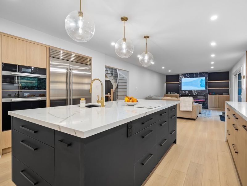 White Open Plan with Black Kitchen Island