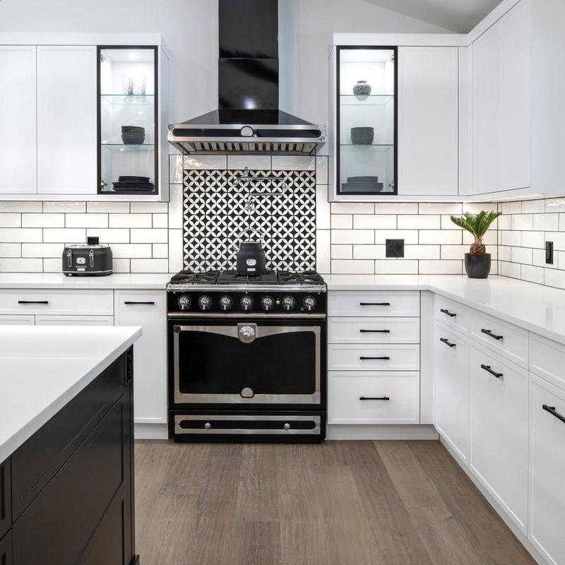 White Cabinets with Black Glass Inserts