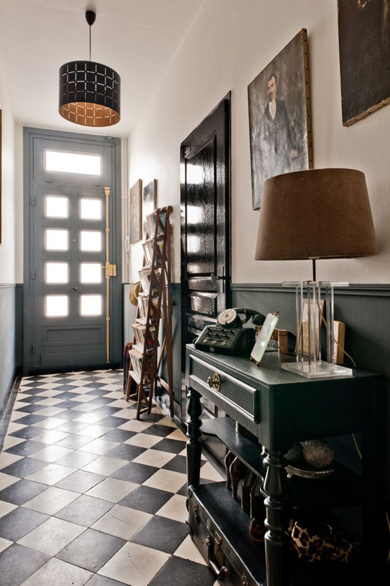 Gothic Entryway With Black Tiles