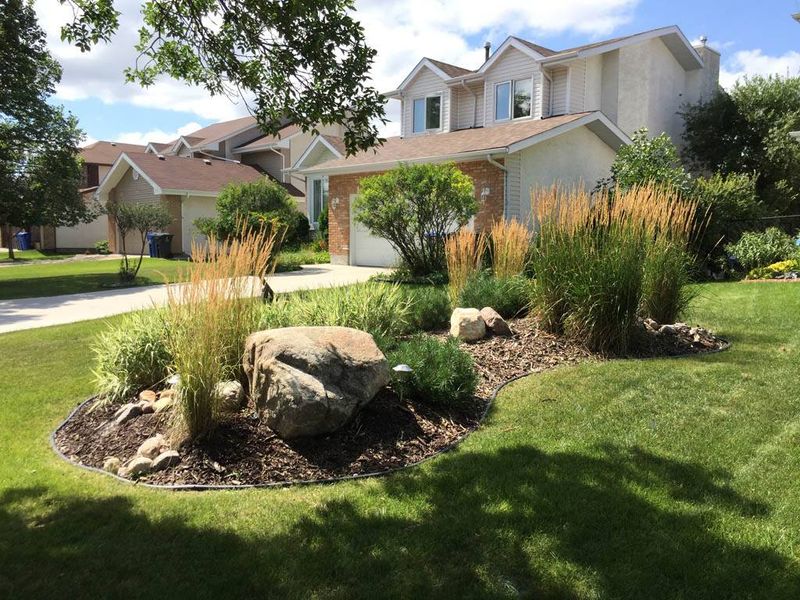 Rustic Mulch And Boulder Combination