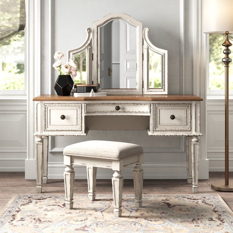 Antique Mirrors Hanging Above a Cream-Colored Vanity