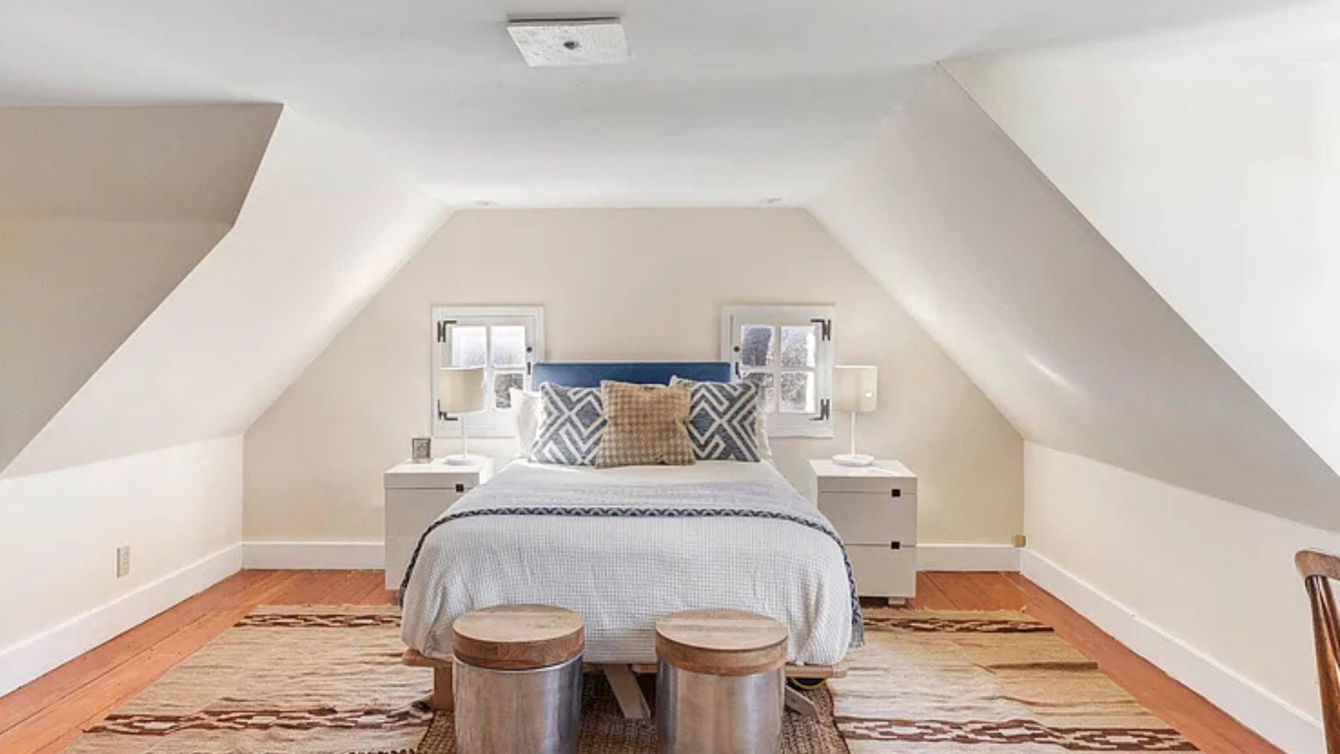 cozy attic bedroom with lots of natural light