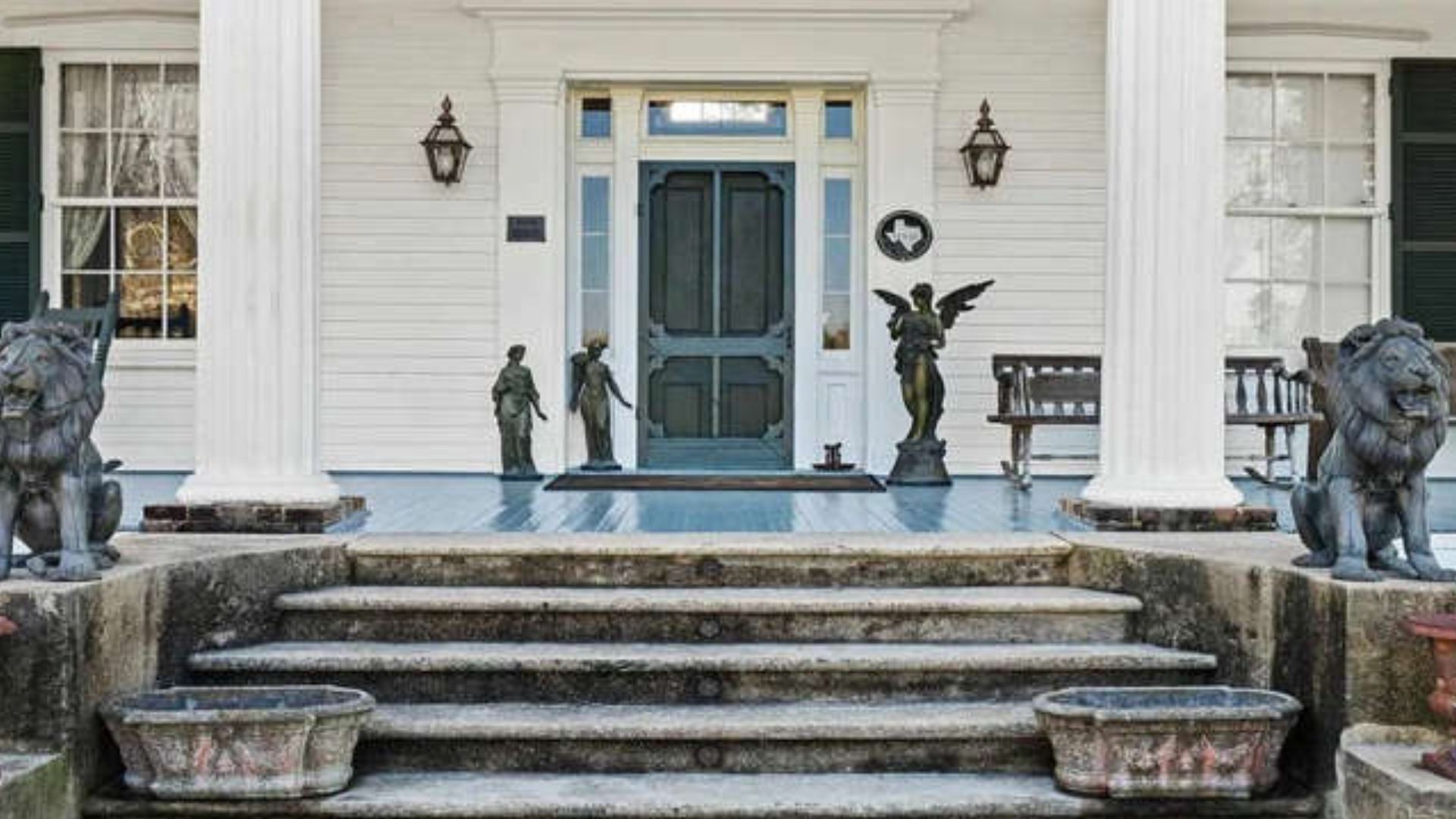 house entrance with statues