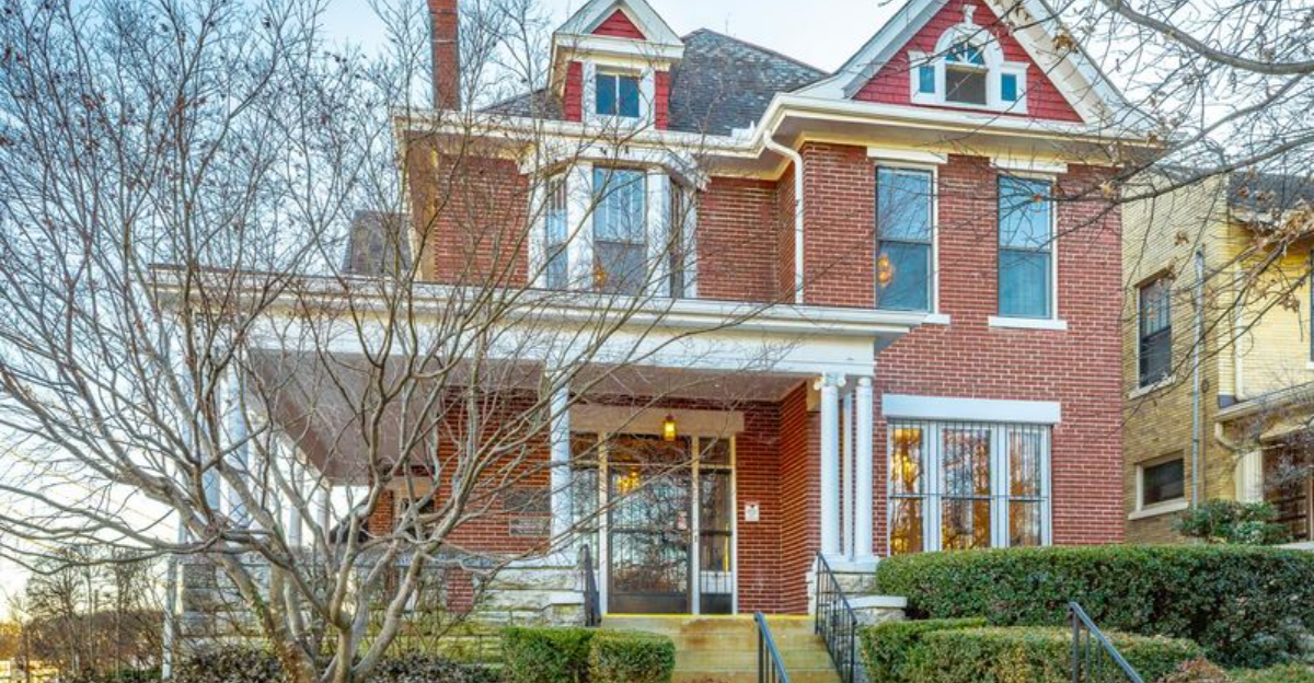 15 Photos To Explore This 1906 Chattanooga Victorian With 7 Fireplaces & Wraparound Porch