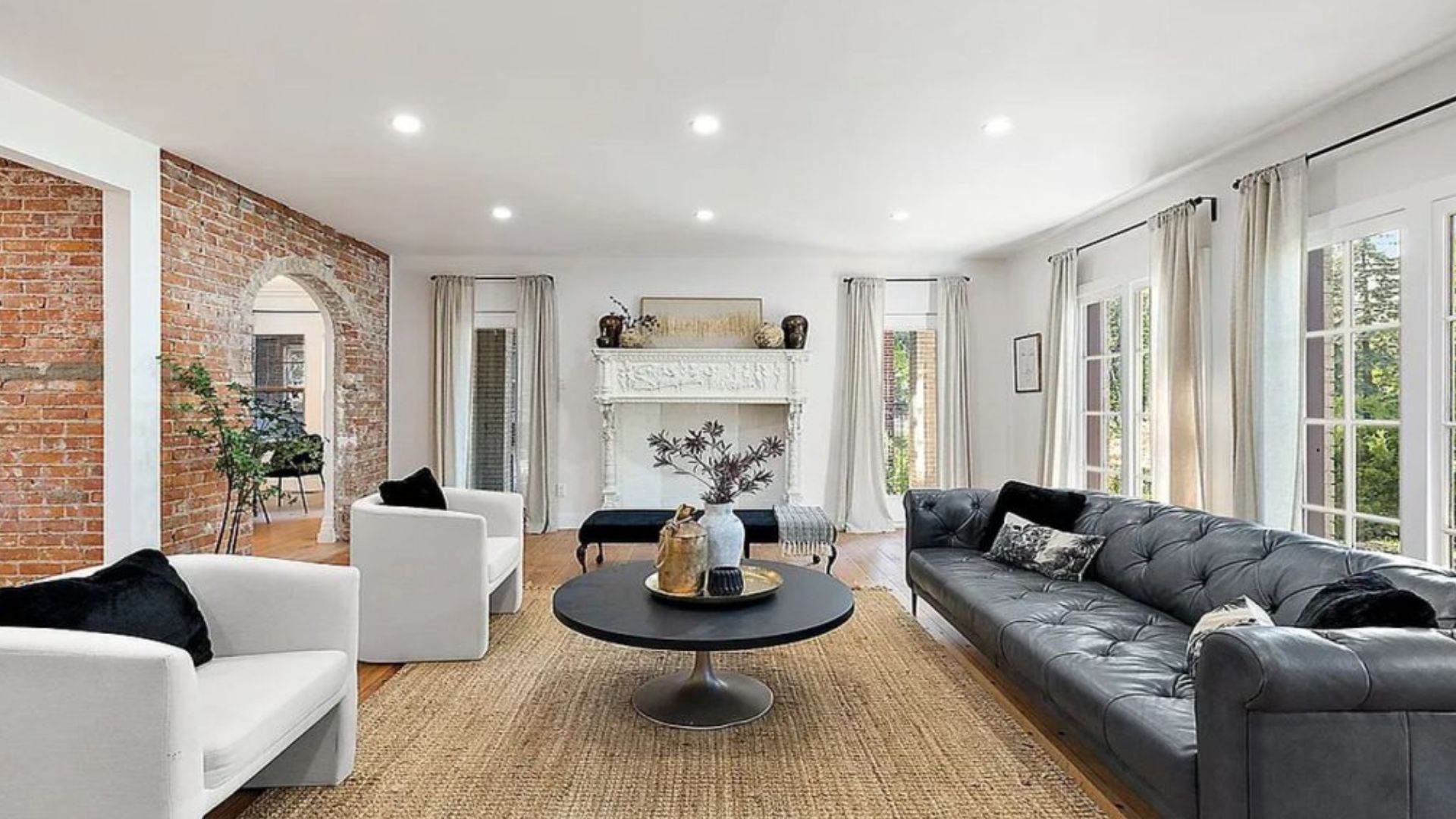 sun drenched living room with original fireplace