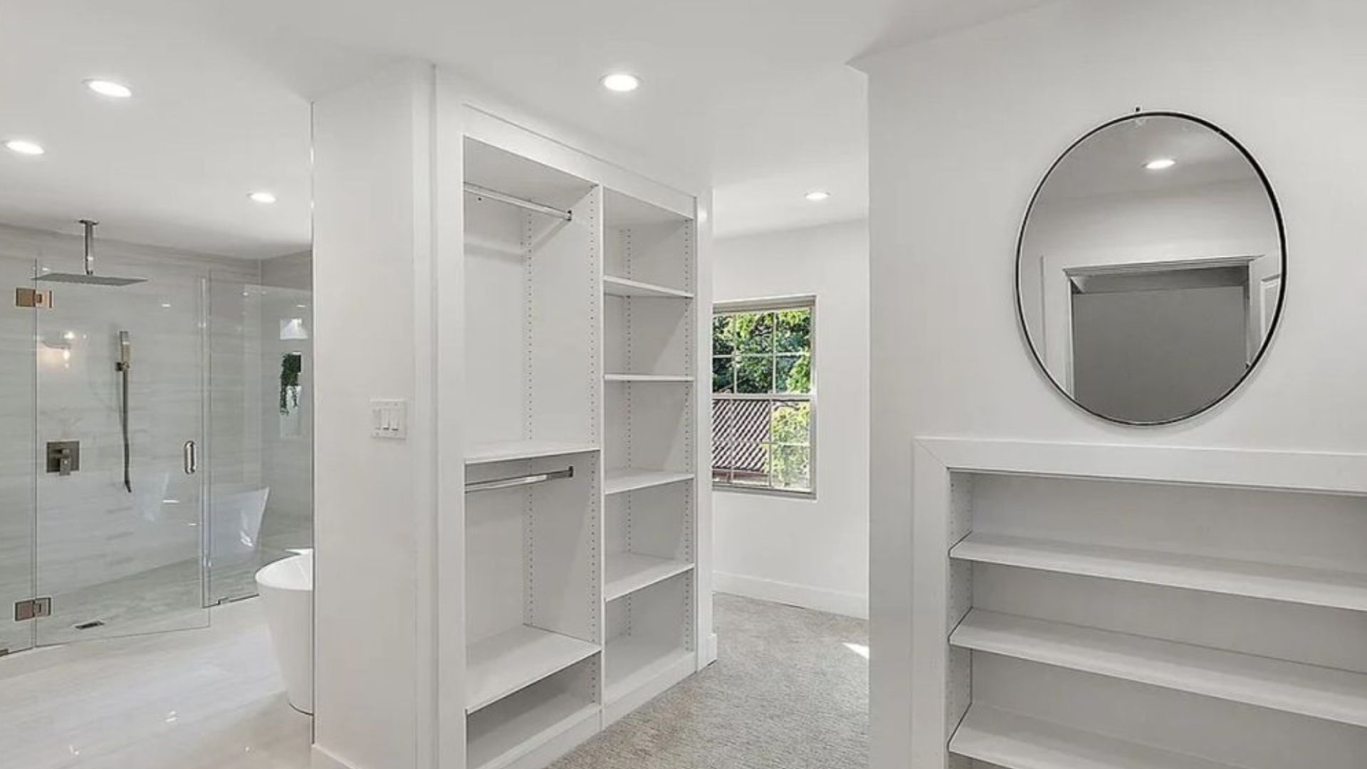 spa-like bathroom with walk-in closet