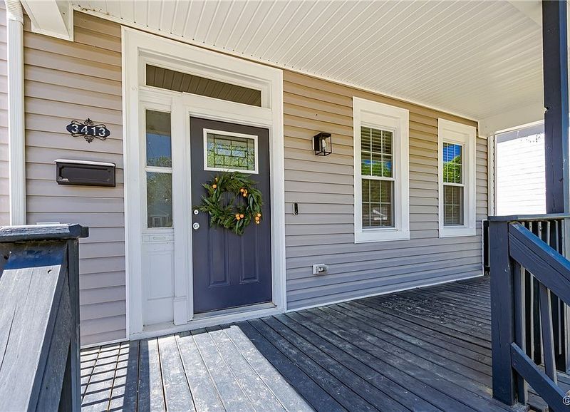 Welcoming Front Porch with Original Columns