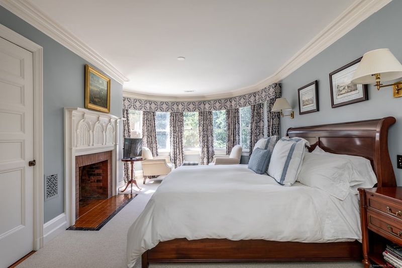 Master Bedroom With Marble Fireplace