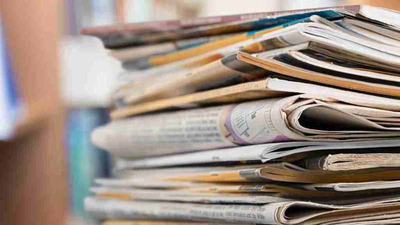 Stacks of Yellowing Newspapers and Magazines