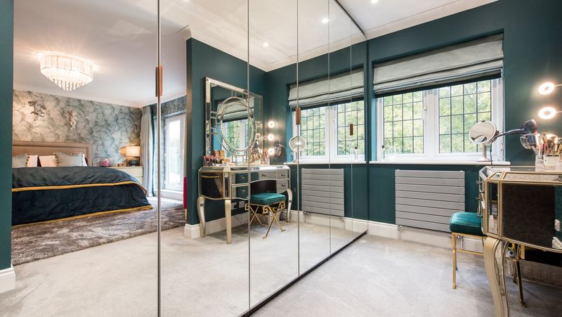 Wall-To-Wall Mirrored Closets