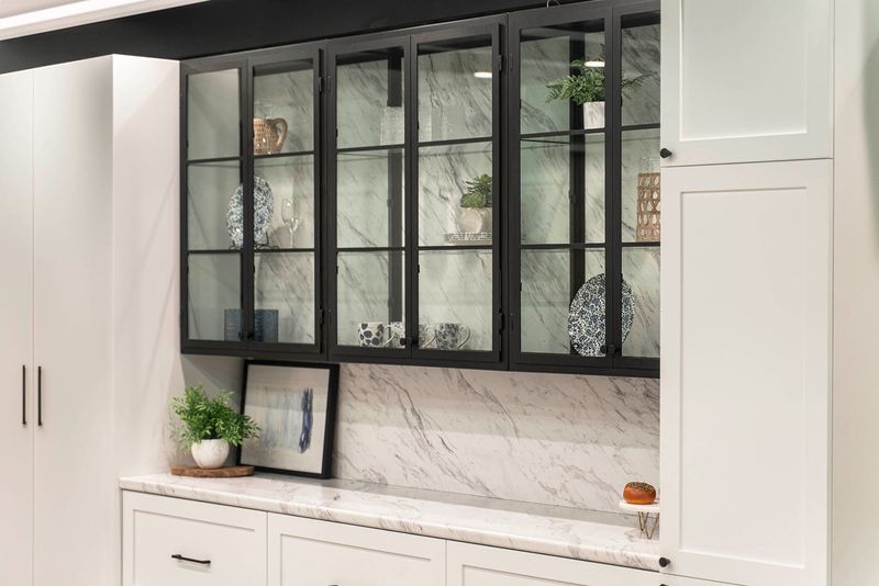 Glass-Front Cabinets With Metal Framing