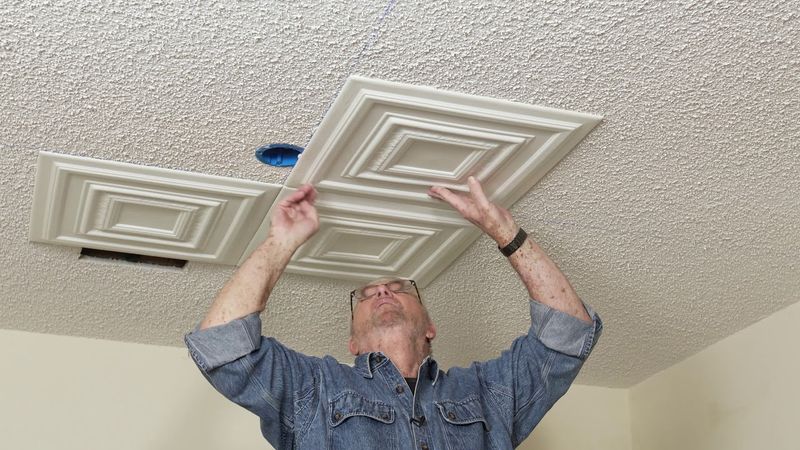 Upgrade Popcorn Ceilings with Peel-and-Stick Tiles
