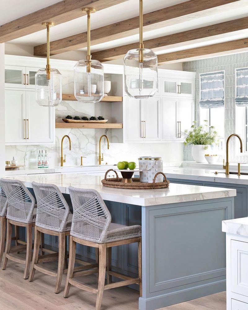 Sun-Drenched White Kitchen with Blue Island