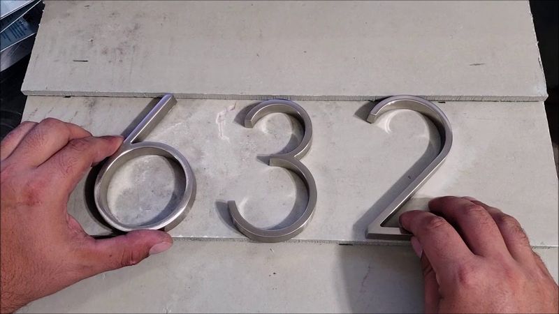 Oversized House Numbers in Clashing Fonts