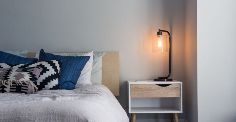 16 Tips For Decorating A Nightstand Without Sacrificing The Essentials, Designers Say