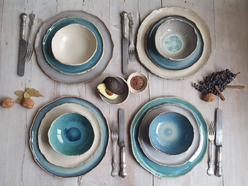 Handmade ceramic dishware replacing mass-produced plates