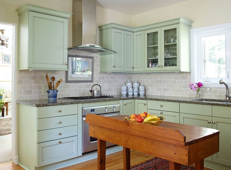 White Painted Brick with Green Cabinetry