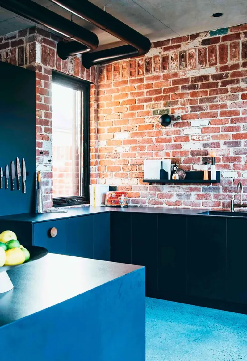 Industrial Brick with Electric Blue Cabinets