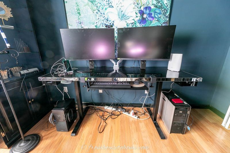 Glass TV stands with visible wires