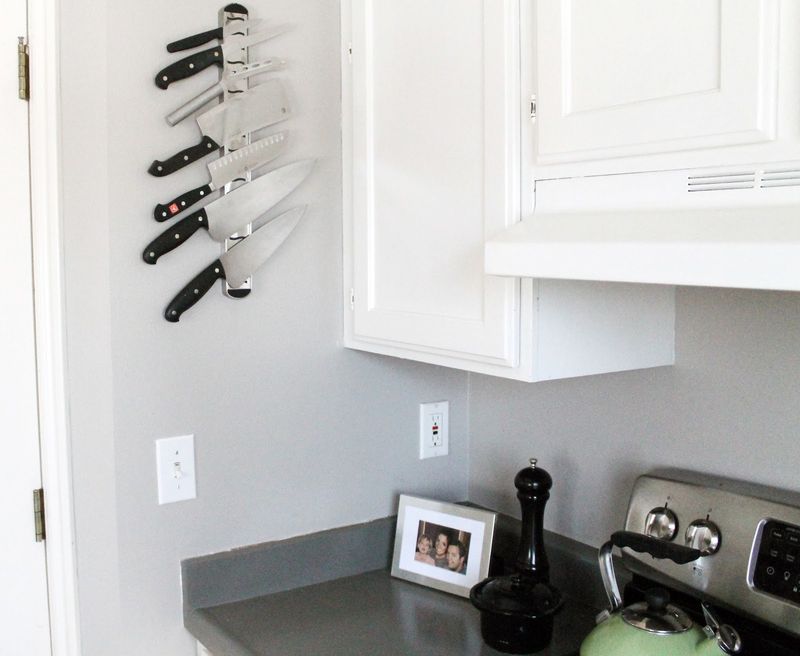 Magnetic knife strips near stove heat
