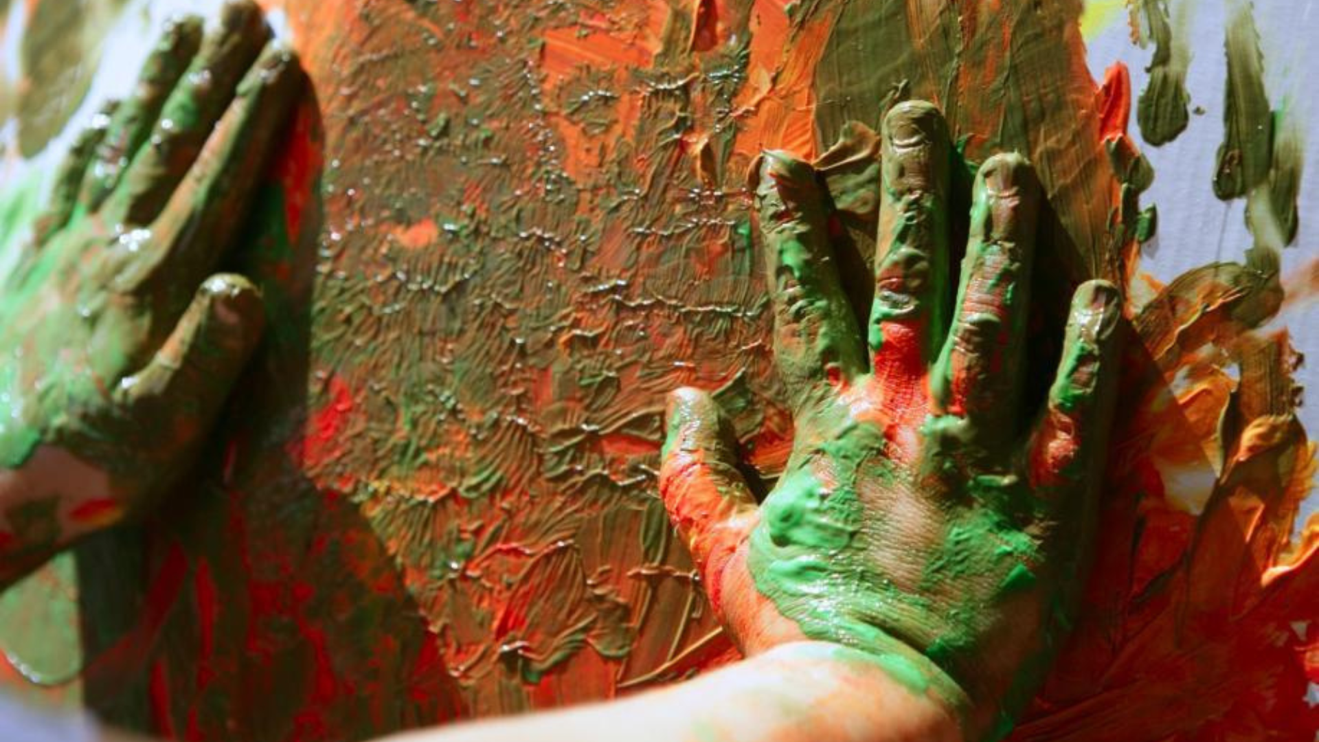child painting with hands