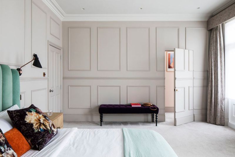 Hidden pet doors within paneled walls