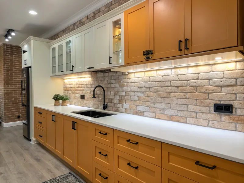 Brick Paver Backsplash with Marigold Cabinets