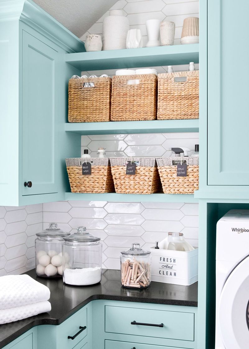 Store Dishes In Decorative Baskets On Open Shelving