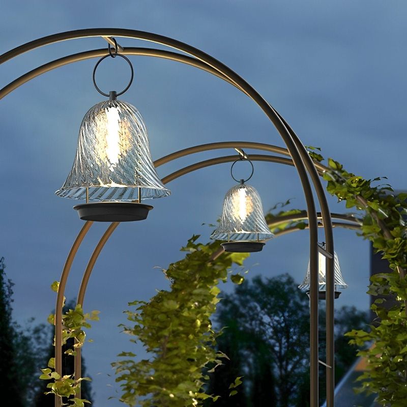 Curved wrought iron arbor with lantern hooks