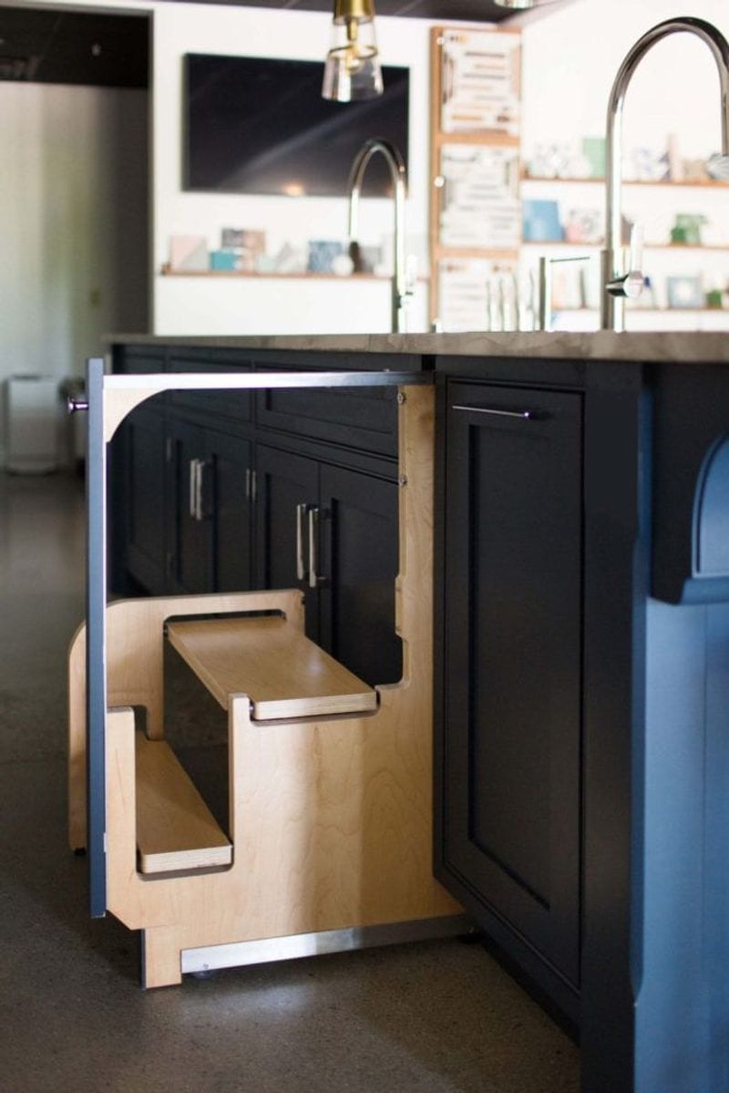 Pull-out step stools built into cabinetry