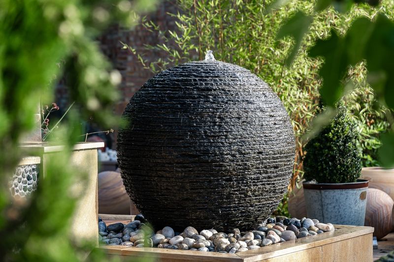 Stacked slate sphere fountains