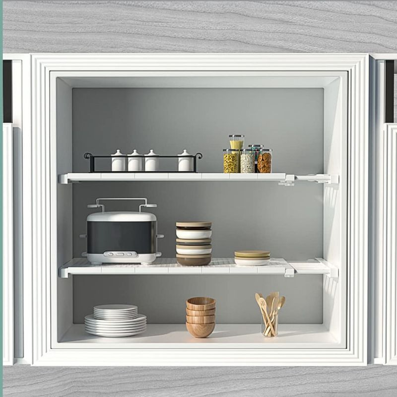 Use Tension Rods For Vertical Plate Storage