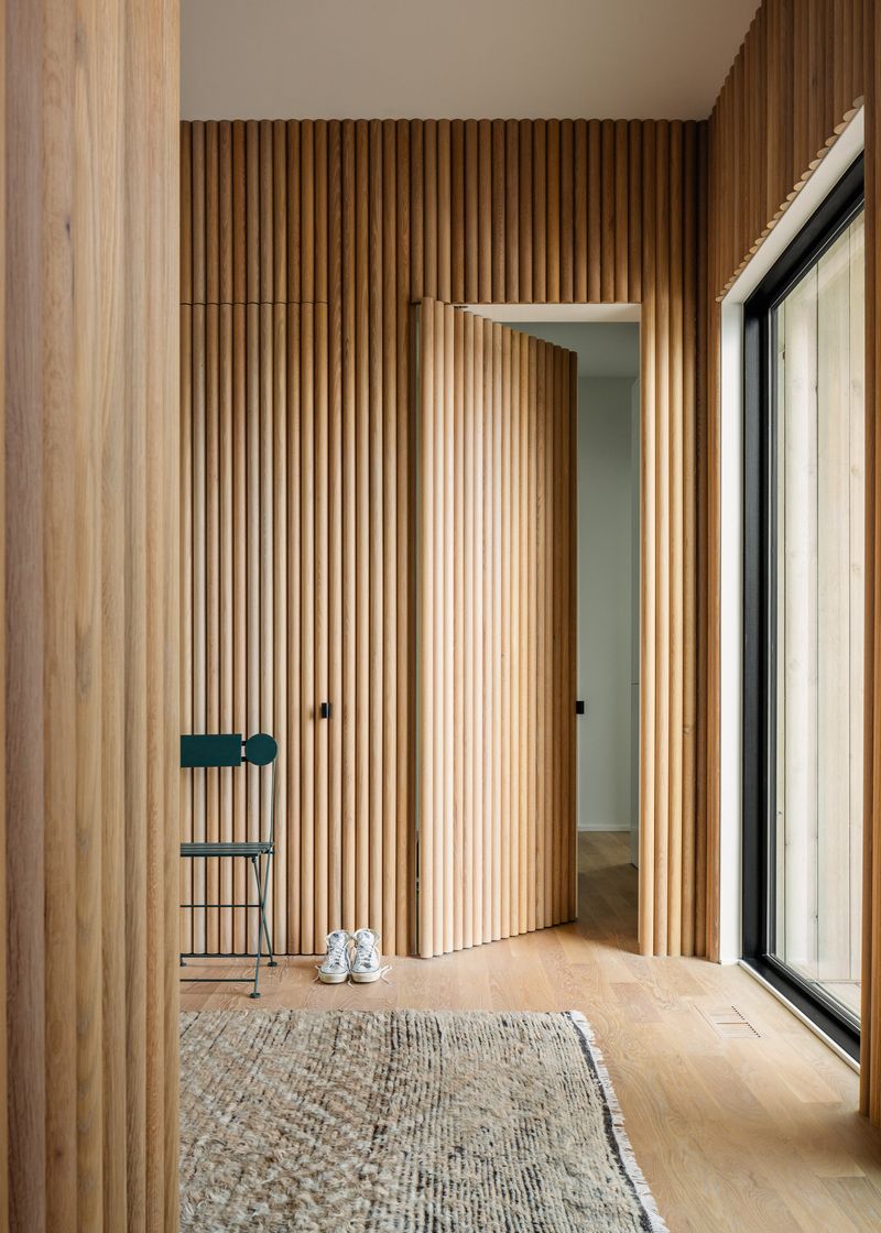 Integrating guest room doors into wood paneling