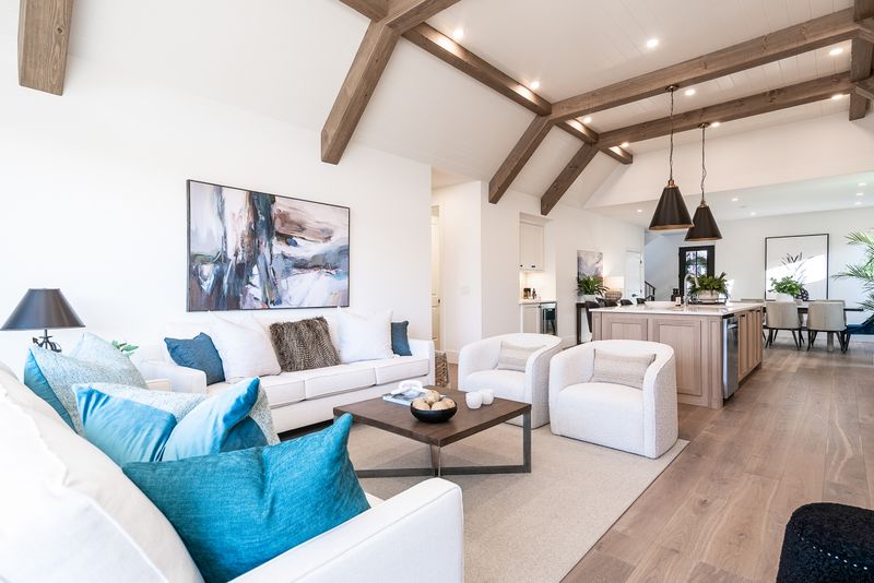 Exposed Wood Beams Paired with Sleek White Walls