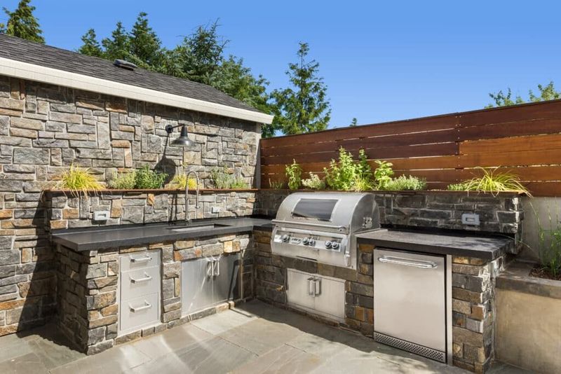 Stone-Clad Island With Built-In Grill