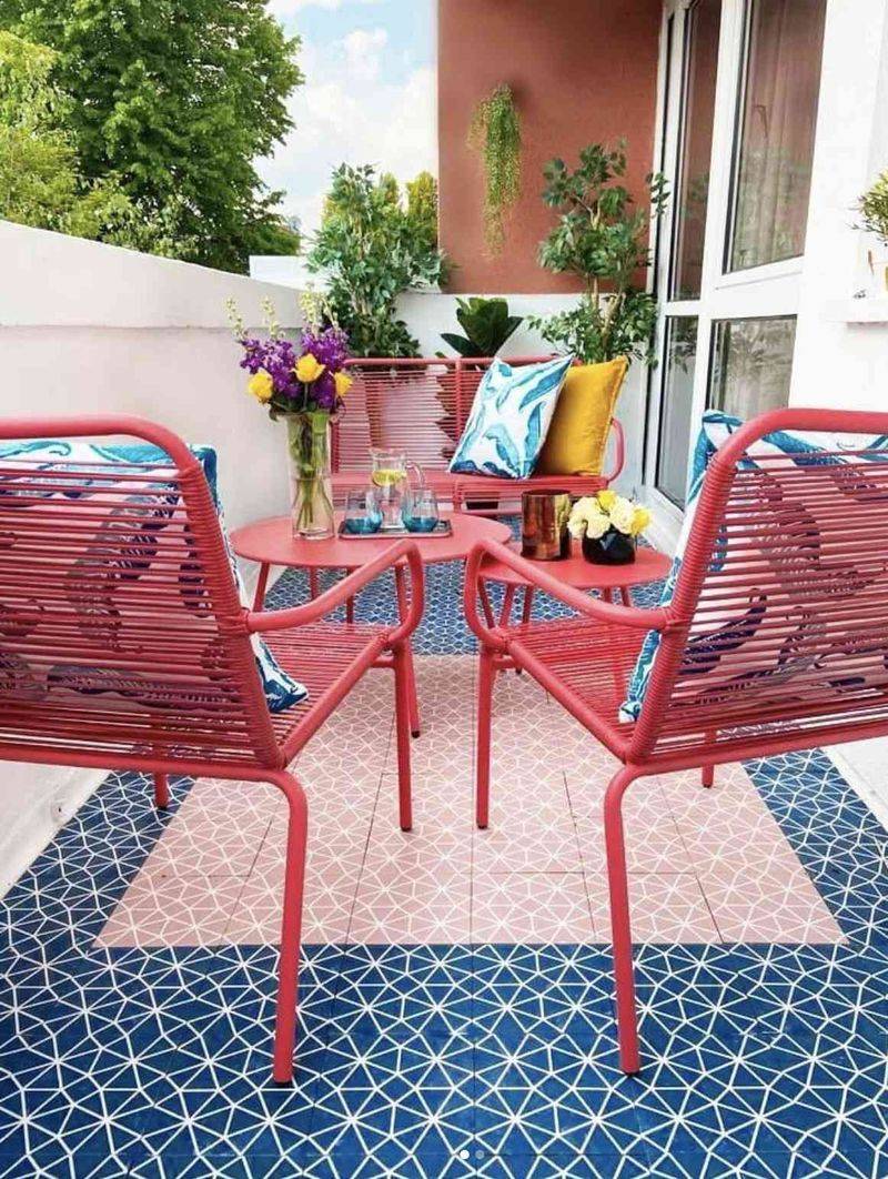 Hot Pink Bistro Set Against White Stucco