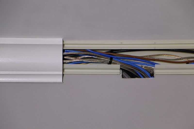 Run cords behind crown molding