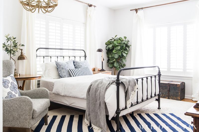 White Painted Wood Floors with Blue Rugs