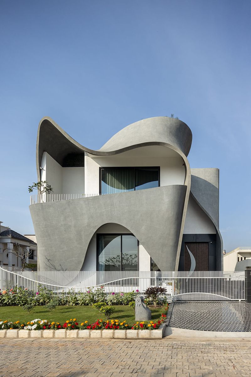Futuristic Curved Concrete Residence