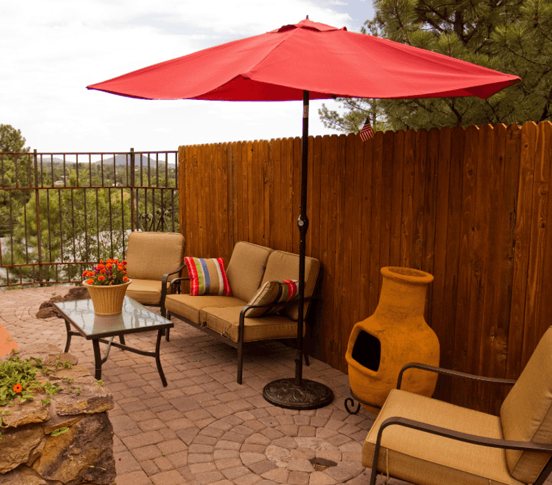 Citrus Orange Umbrella Over a Tiny Café Table