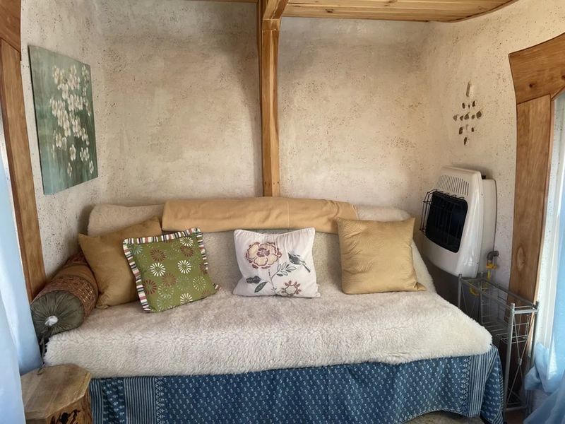 Natural clay walls and terrazzo finishes inside