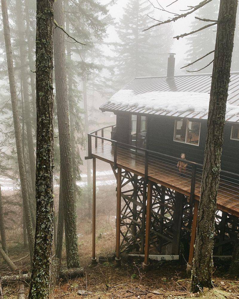 House Perched on Stilts in Foggy Forest