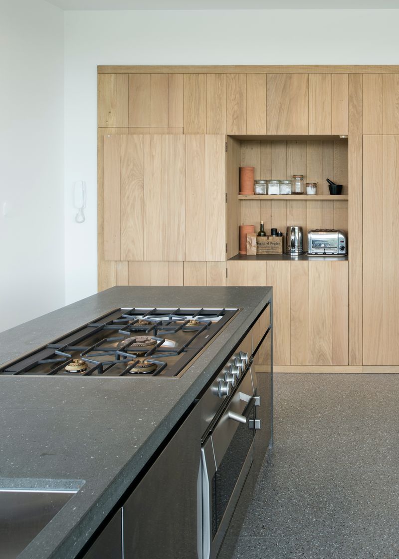 Warm Minimalism with Hidden Appliance Garage