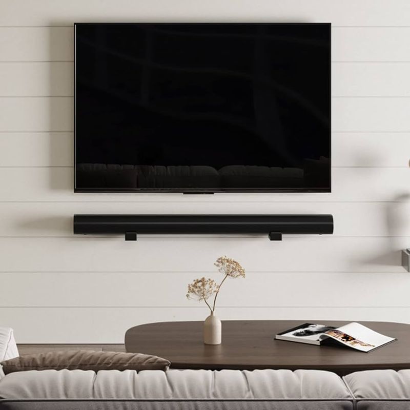 Mount a soundbar below the TV