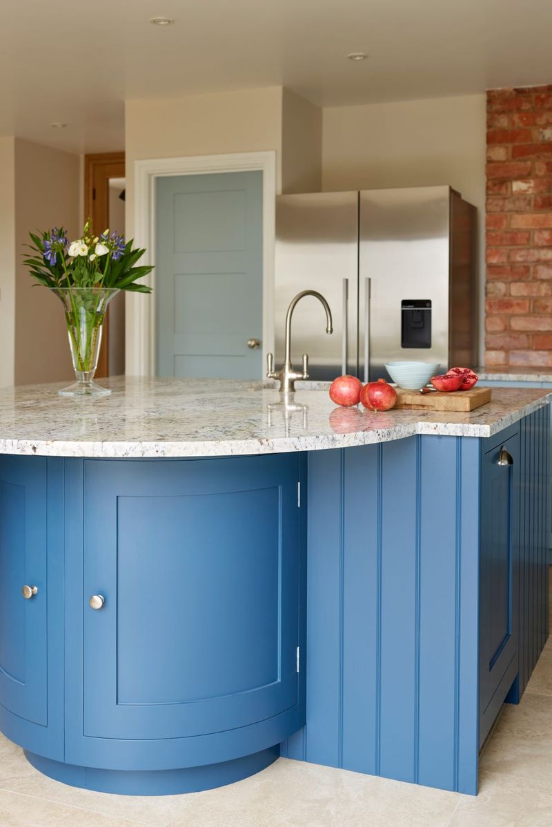 Glossy Teal Island Topped with Brushed Copper Counter